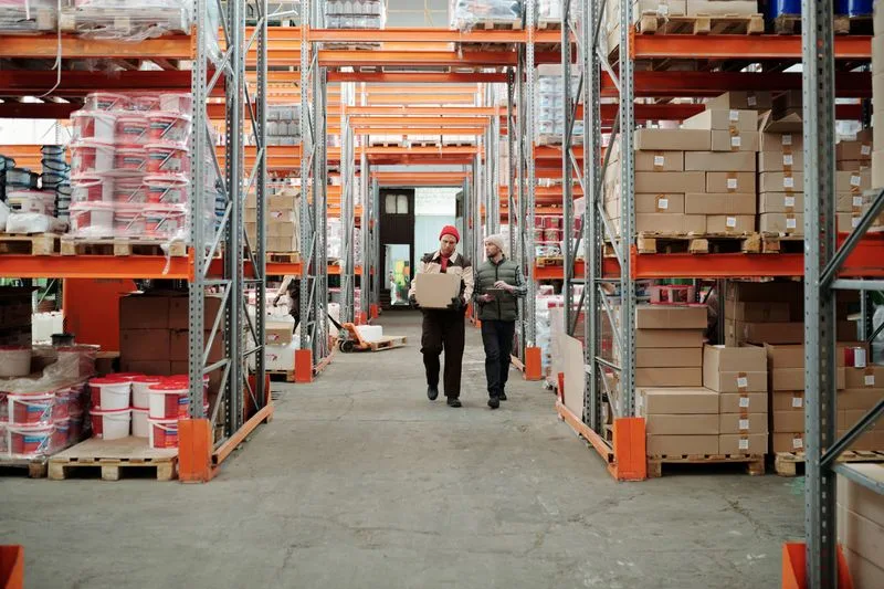 Warehouse staff moving stock through a distribution centre